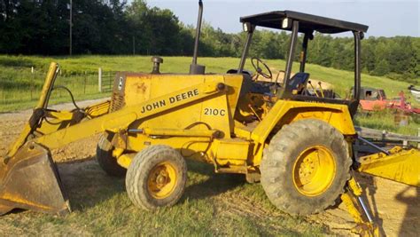 john deere 210c backhoe loader with skid steer implement mounting|john deere 210c hydraulic loader.